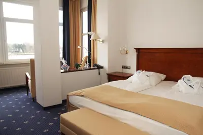 Ein Bett oder Betten in einem Zimmer der Unterkunft Hotel Deutscher Kaiser