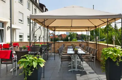 Ein Restaurant oder anderes Speiselokal in der Unterkunft Tryp by Wyndham Luebeck Aquamarin