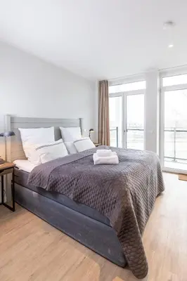 Ein Bett oder Betten in einem Zimmer der Unterkunft Dockside Travemünde