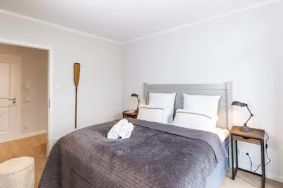 Ein Bett oder Betten in einem Zimmer der Unterkunft Dockside Travemünde