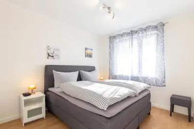 Ein Bett oder Betten in einem Zimmer der Unterkunft Ferienwohnung Abendsonne