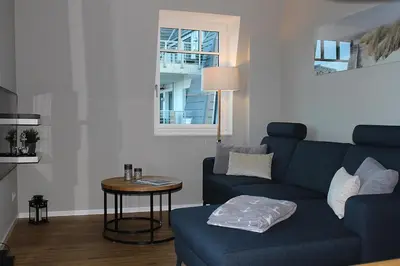 Ein Sitzbereich in der Unterkunft Objekt 96 - Appartement Meerblick