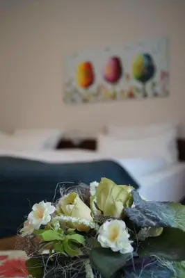 Ein Bett oder Betten in einem Zimmer der Unterkunft Hotel Forsthaus St. Hubertus