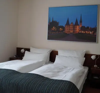 Ein Bett oder Betten in einem Zimmer der Unterkunft Hotel Forsthaus St. Hubertus