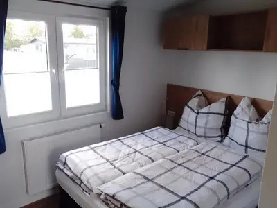 Ein Bett oder Betten in einem Zimmer der Unterkunft Natur-Campingplatz Salemer See