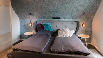 Ein Bett oder Betten in einem Zimmer der Unterkunft Ocean House Penthousewohnung Wolke 7 mit Whirlpool