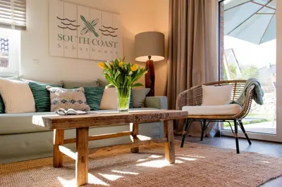 Ein Sitzbereich in der Unterkunft Ferienhaus SOUTH COAST