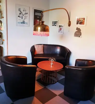 Ein Sitzbereich in der Unterkunft Hotel Schweizerhaus