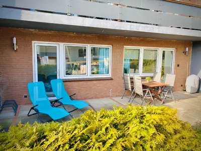 Ein Sitzbereich in der Unterkunft FeWo STRANDGUT- Familien - Hunde - strandnah - eigene Terrasse - Sauna & Wellness