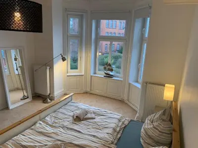 Ein Bett oder Betten in einem Zimmer der Unterkunft Villa Wakenitz