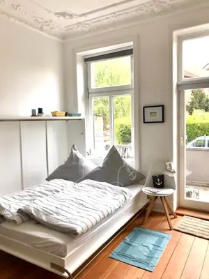 Ein Bett oder Betten in einem Zimmer der Unterkunft Villa Wakenitz