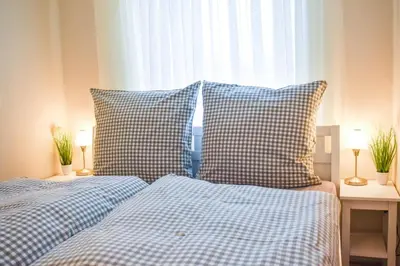 Ein Bett oder Betten in einem Zimmer der Unterkunft Ferienwohnung Strandbude 11 -Timmendorfer Strand