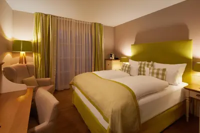 Ein Bett oder Betten in einem Zimmer der Unterkunft Fuchsbau Romantik Hotel & SPA Restaurant & FOX Bar