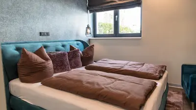 Ein Bett oder Betten in einem Zimmer der Unterkunft Beach House Meerlust mit Whirlpool
