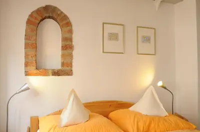 Ein Bett oder Betten in einem Zimmer der Unterkunft Hotel zur alten Stadtmauer