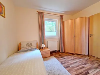 Ein Bett oder Betten in einem Zimmer der Unterkunft (STR132a) Haus Maren am Meer