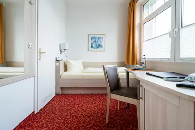Ein Bett oder Betten in einem Zimmer der Unterkunft Hotel Gorch Fock
