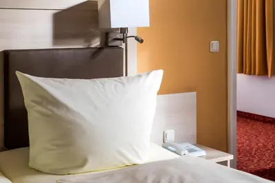 Ein Bett oder Betten in einem Zimmer der Unterkunft Hotel Gorch Fock