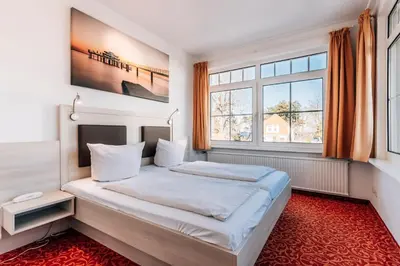 Ein Bett oder Betten in einem Zimmer der Unterkunft Hotel Gorch Fock