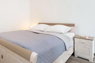 Ein Bett oder Betten in einem Zimmer der Unterkunft Augustusbad 