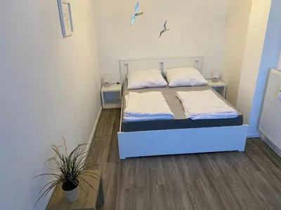 Ein Bett oder Betten in einem Zimmer der Unterkunft Ferienwohnung Elena