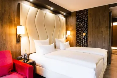 Ein Bett oder Betten in einem Zimmer der Unterkunft PLAZA Premium Timmendorfer Strand