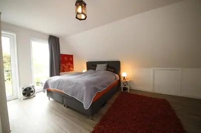 Ein Bett oder Betten in einem Zimmer der Unterkunft Ferienhaus Meerplatz - bis 10 Personen