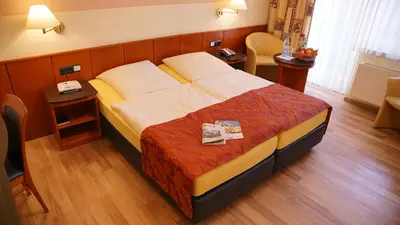 Ein Bett oder Betten in einem Zimmer der Unterkunft Aura Hotel