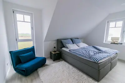 Ein Bett oder Betten in einem Zimmer der Unterkunft Haus Strandgut