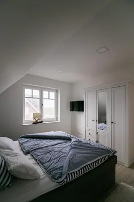 Ein Bett oder Betten in einem Zimmer der Unterkunft Haus Strandgut