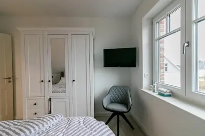 Ein Bett oder Betten in einem Zimmer der Unterkunft Haus Strandgut