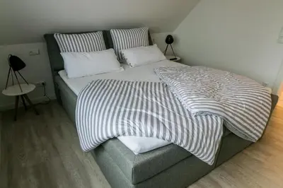 Ein Bett oder Betten in einem Zimmer der Unterkunft Haus Strandgut