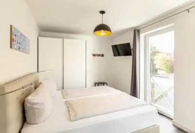 Ein Bett oder Betten in einem Zimmer der Unterkunft Ferienwohnung Reede 54