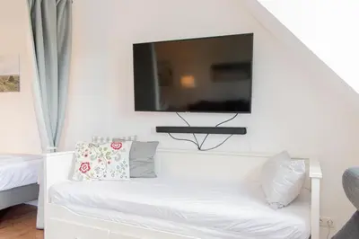 TV/Unterhaltungsangebot in der Unterkunft Ferienwohnung Strand Lounge