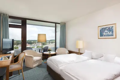 Ein Bett oder Betten in einem Zimmer der Unterkunft Maritim Strandhotel Travemünde