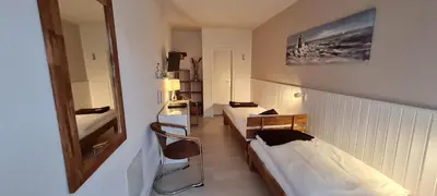 Ein Bett oder Betten in einem Zimmer der Unterkunft Hotel Herrenhof