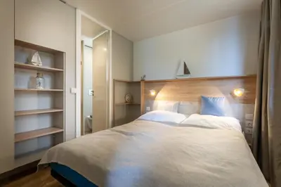 Ein Bett oder Betten in einem Zimmer der Unterkunft Düne 47