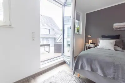 Ein Bett oder Betten in einem Zimmer der Unterkunft Ferienwohnung Bude 37 Whg 7