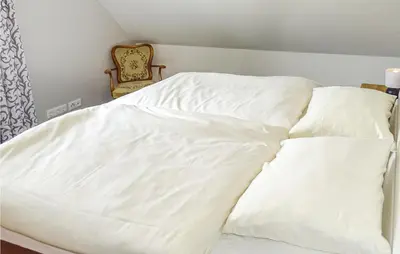Ein Bett oder Betten in einem Zimmer der Unterkunft Beautiful Home In Groß Schwansee