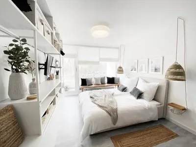 Ein Bett oder Betten in einem Zimmer der Unterkunft Seaside Rooms - Zentrales Design-Apartment mit Balkon & Parkplatz - 2 Minuten zum Strand