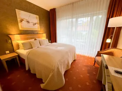 Ein Bett oder Betten in einem Zimmer der Unterkunft Hotel Villa Gropius