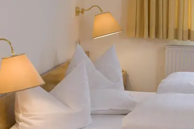 Ein Bett oder Betten in einem Zimmer der Unterkunft Hotel Parkfrieden