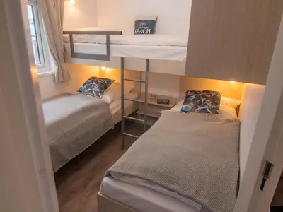 Ein Bett oder Betten in einem Zimmer der Unterkunft Strand 2