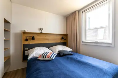 Ein Bett oder Betten in einem Zimmer der Unterkunft Muschel 60