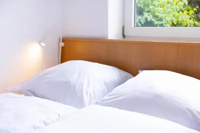 Ein Bett oder Betten in einem Zimmer der Unterkunft DKK1c Ferienwohnung Mole 1