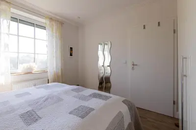 Ein Bett oder Betten in einem Zimmer der Unterkunft Ferienwohnung Boje 3