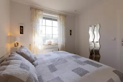 Ein Bett oder Betten in einem Zimmer der Unterkunft Ferienwohnung Boje 3