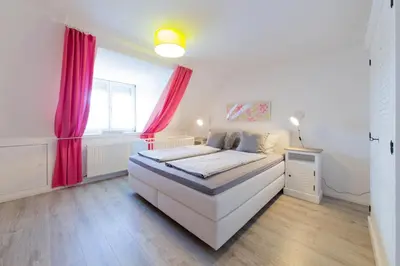 Ein Bett oder Betten in einem Zimmer der Unterkunft Ferienhaus Haff Huus
