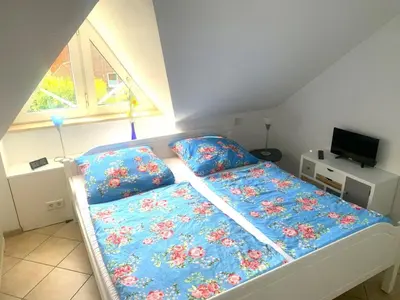Ein Bett oder Betten in einem Zimmer der Unterkunft Windrose