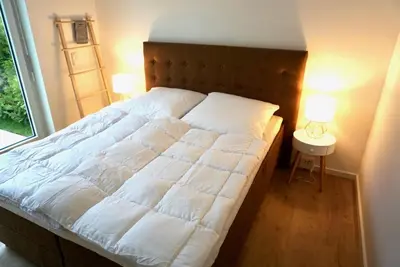 Ein Bett oder Betten in einem Zimmer der Unterkunft Strandglück
